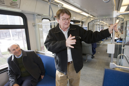Al Hartmann  |  Tribune file photo
John Inglish, standing, received a $22,700 bonus last year on top of the previous year's $364,000 total compensation for his position as CEO of the Utah Transit Authority. Since leaving the agency in April 2012, he has begun drawing a $200,000 annual pension. UTA General Manager Mike Allegra, seated, received a bonus last year of $25,000.