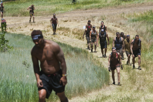 Chris Detrick  |  The Salt Lake Tribune
Competitors hike up a hill during the Utah Spartan Beast Race at Soldier Hollow Saturday June 29, 2013. The 12-mile race included obstacles like mud pits with barbed wire, rope climbs, jumping over fire and climbing an eight-foot wall.