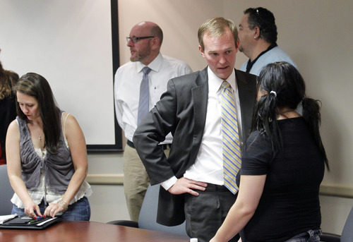 Al Hartmann  |  The Salt Lake Tribune
Salt Lake County Mayor Ben McAdams meets with mental health advocates and patients over people being cut and discharged due to the latest Valley Mental Health cuts.