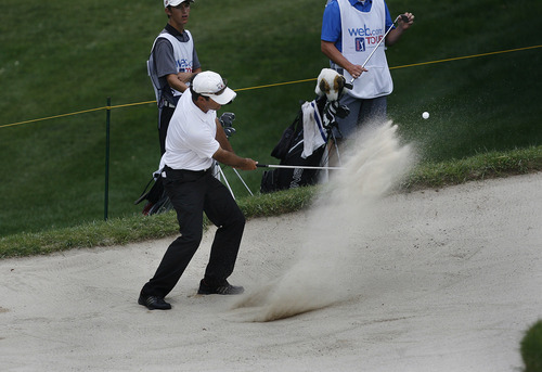 Scott Sommerdorf   |  The Salt Lake Tribune
Joseph Summerhays chips out of a bunker off the green at #11 at Willow Creek Country Club, Thursday, July 11, 2013.