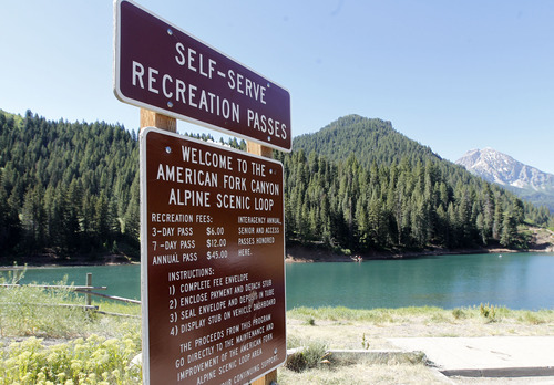 Al Hartmann  |  The Salt Lake Tribune
A self-service fee station is shown at the Tibble Fork Reservoir parking lot in American Fork Canyon. The reservoir has the largest parking lot in the canyon and it's busy with bicyclists, fishermen, hikers, picnickers and off-road vehicle riders. The U.S. Forest Service is overhauling its recreational fee program for American Fork Canyon and Mirror Lake Scenic Byway. Instead of charging everyone who drives into these areas, the Forest Service proposes charging only those who use the recreational amenities.