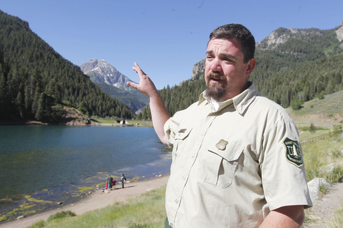 Al Hartmann  |  The Salt Lake Tribune
Jon Stansfield, Forest Service ranger, has the job of accommodating the huge numbers of peope in American Fork Canyon who want to bicycle, fish, hike, picnic, camp, climb and ride OHV's. The U.S. Forest Service is overhauling its recreational fee program for American Fork Canyon and Mirror Lake Scenic Byway. Instead of charging everyone who drives into these areas, the Forest Service proposes charging only those who use the recreational amenities.