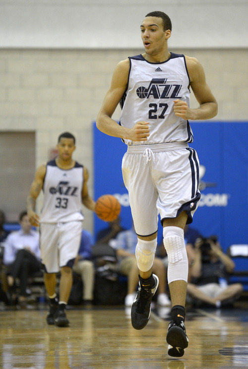 Utah Jazz center Rudy Gobert (27) runs up the court as guard Trey Burke follows behind with the ball during the first half of an NBA Orlando Pro Summer League game against the Miami Heat in Orlando, Fla., Sunday, July 7, 2013. (Special to the Tribune/Phelan M. Ebenhack)