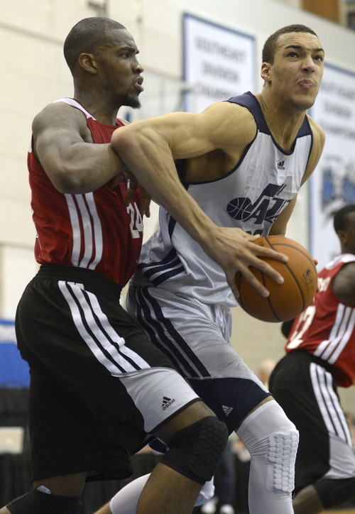 Utah Jazz center Rudy Gobert, right, sets up for a shot in front of Miami Heat center Jarvis Varnado during the second half of an NBA Orlando Pro Summer League game in Orlando, Fla., Sunday, July 7, 2013. (Special to the Tribune/Phelan M. Ebenhack)