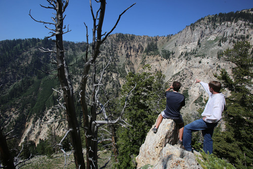 Francisco Kjolseth  |  The Salt Lake Tribune
Brad Rasmussen, left, who helps organize housing for the Outdoor Retailers convention, and attorney Charles Livsey look over some of the areas at the top of Big Cottonwood Canyon that Great Western Mining is proposing to transfer into the public domain.
