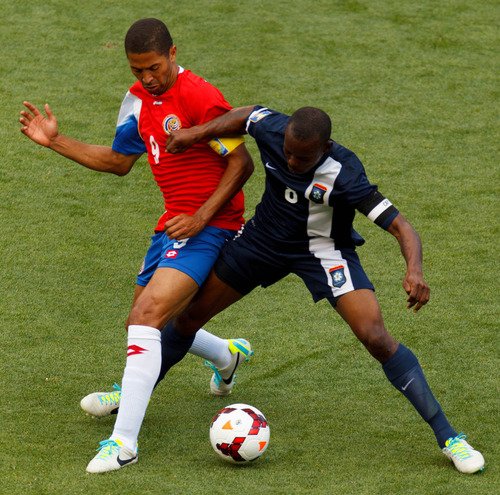 Trent Nelson  |  The Salt Lake Tribune
Costa Rica's Alvaro Saborio gets tangled up with Belize's Elroy Smith (8) defending as Costa Rica defeats Belize 1-0 in CONCACAF Gold Cup soccer at Rio Tinto Stadium in Sandy, Saturday July 13, 2013.