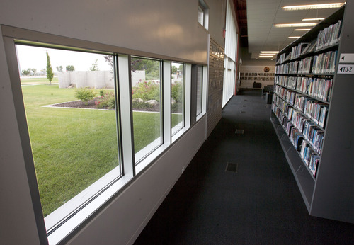 Steve Griffin  |  The Salt Lake Tribune
Some of the many windows at the Pleasant Valley Library Branch in Washington Terrace Thursday July 11, 2013. The library is the newest of the county's libraries and exemplifies the idea of libraries as "third places" where people gather for a number of reasons rather than places to check out books. In addition to its black box theater, the Pleasant Valley branch features art, has a coffee shop and inviting areas for people to engage together or with technology and databases they'd otherwise not be able to access.