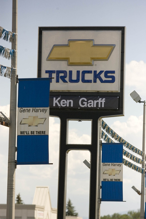 Paul Fraughton  |   Salt Lake Tribune
A sign claiming that  Gene Harvey  will be there  has a certain irony since  the dealership was purchased by Ken Garff Automotive Group.                            
 Monday, July 15, 2013