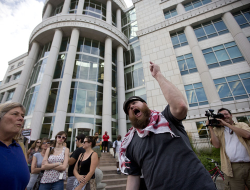 Lennie Mahler  |  The Salt Lake Tribune
Jacob Jensen leads a chant during a rally to honor Trayvon Martin and condemn the jury which found George Zimmerman not guilty of murder. Jensen asked, "Who will indict the US justice system for finding George Zimmerman innocent?" Salt Lake City, Utah. Monday, July 15, 2013.