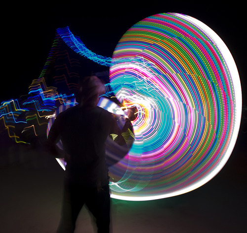 Rick Egan  | The Salt Lake Tribune 

A man spins an electronic hula hoop, at the Element 11 Arts Festival at Bonneville Seabase, Thursday, July 11, 2013.