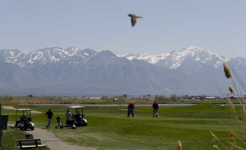 Trent Nelson  |  Tribune file photo
Golfers tee off on the ninth hole at Salt Lake City's Wingpointe golf course. The city-owned course is operating as usual for the 2013 season although a pending demand from the FAA could cause a dramatic increase in Wingpointe's lease.