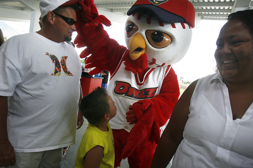 Scott Sommerdorf   |  The Salt Lake Tribune
The Orem Owlz mascot "Hootz" playfully steals a fan's cap just prior to gametime as the Owlz play the Billings Mustangs in Orem, Sunday, July 14, 2013.