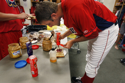 Scott Sommerdorf   |  The Salt Lake Tribune
As opposed to the sumptuous pre-game buffets in the major leagues, Owlz pitcher Garrett Bush makes himself a peanut butter, jelly and honey sandwich prior to the Orem Owlz game versus the Billings Mustangs, Sunday, July 14, 2013.