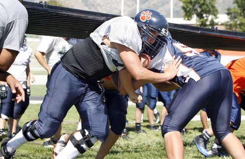Francisco Kjolseth  |  The Salt Lake Tribune
Brighton High school features a large offensive line, including 6-foot-7 tackle Jackson Barton, a junior who has already committed to Utah, as he works out with the team at Brighton.