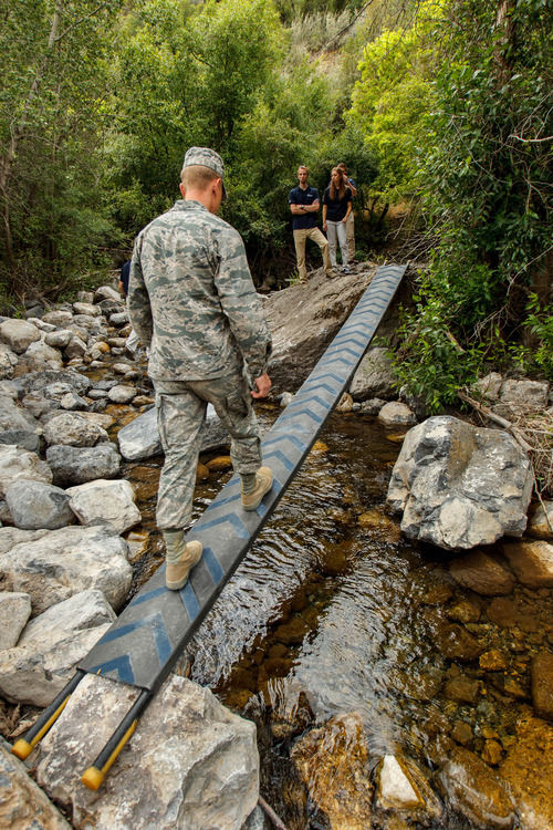 Trent Nelson  |  The Salt Lake Tribune
US Air Force ROTC Cadet Chase Hicken crosses Utah State University's winning design of a Break-Apart Mobile Bridging and Infiltration device (BAMBI) during a demonstration Tuesday July 16, 2013 in Logan Canyon.