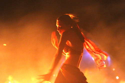 Rick Egan  | The Salt Lake Tribune 

Nala Rogers dances around the flames of the Valhalla Viking Ship, after it was set on fire late Saturday during the Element11 Arts Festival at Bonneville Seabase, Saturday, July 13, 2013.