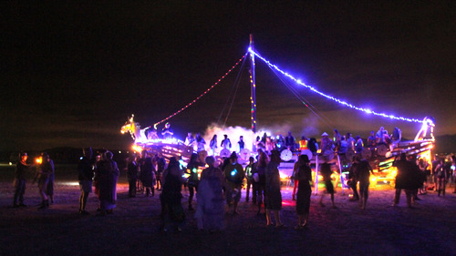 Rick Egan  | The Salt Lake Tribune 

Particpants dance in front of the Valhalla Viking Ship at the Element 11 Arts Festival at Bonneville Seabase, Thursday, July 11, 2013.