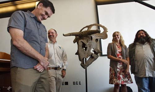 Leah Hogsten  |  The Salt Lake Tribune
l-r The research team led by Scott Sampson, who dubbed the creature in honor of Grand Staircase-Escalante National Monument paleontologist Alan Titus, share a laugh with fellow authors Katherine Clayton and Mark Loewen at the unveiling. The newly named dinosaur, Nasutoceratops titusi, was unveiled by paleontologists from the Natural History Museum of Utah, the Bureau of Land Management, and the Denver Museum of Nature & Science at Utah's Natural History Museum on Wednesday, July 17, 2013. It was  discovered in 2006 in the Grand Staircase-Escalante National Monument,