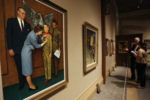 Scott Sommerdorf  |  The Salt Lake Tribune
In the foreground at left is "A Great Moment" 1963 - Norman Rockwell. An illustration for the 1965 Brown & Bigelow Calendar.
"American Originals: Norman Rockwell and Scouting" features 23 original works of art by Norman Rockwell at the LDS Church History Museum. Original artwork in the exhibit draws from a collection of paintings used for Boy Scout calendars and covers of Boys' Life magazine, Thursday, July 18, 2013.