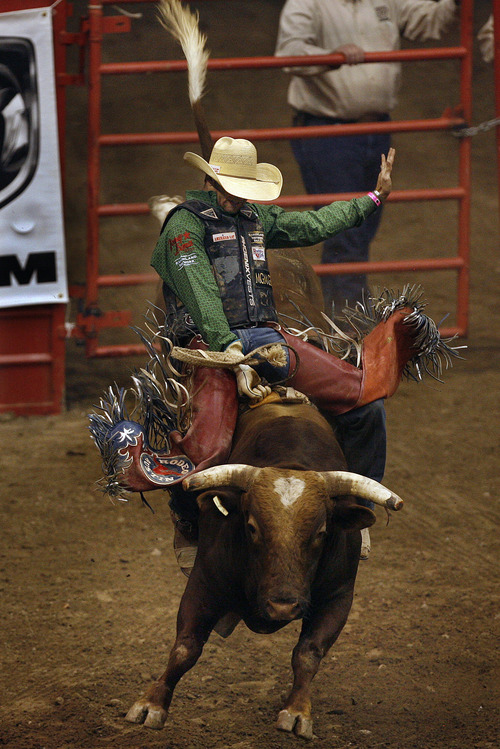 Scott Sommerdorf   |  The Salt Lake Tribune
JW Harris, rides "Bush Baby" to an 78 point ride to put him at 4th in the Bullriding competition in The Days of '47 Rodeo at EnergySolutions Arena, Friday, July 19, 2013.