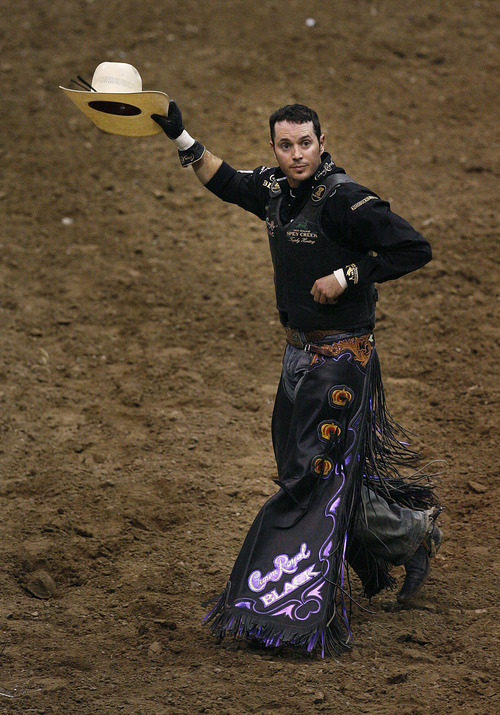 Scott Sommerdorf   |  The Salt Lake Tribune
Wesley Silcox of Santaquin, UT gives the crowd a tip of his cap as they applaude his 89 point ride on "Koma King" to lead the bullriding competition at The Days of '47 Rodeo at EnergySolutions Arena, Friday, July 19, 2013.