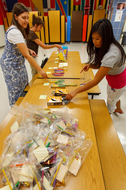 Trent Nelson  |  The Salt Lake Tribune
Misti Mitchell, Jill Hill and Elizabeth Romrell assemble kits for faculty and staff at Woodrow Wilson Elementary School in Salt Lake City, Thursday as part of United Way's Summer of Service.