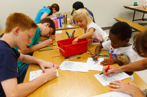 Trent Nelson  |  The Salt Lake Tribune
Kids color pages to go in a welcome kit for faculty and staff at Woodrow Wilson Elementary School in Salt Lake City, Thursday as part of United Way's Summer of Service.