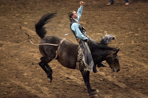 Kim Raff | The Salt Lake Tribune
Orin Larsen competes in the bareback riding event during the Days of 47 Rodeo at the Maverik Center in West Valley, Utah on July 21, 2012.