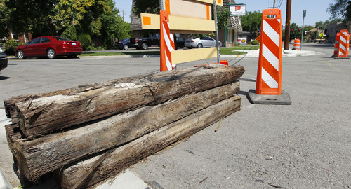 Al Hartmann  |  The Salt Lake Tribune
Old railroad ties are stacked at intersection of Sherman Avenue (1340 South) and 900 East. The city is reconstructing part of 900 East south of 1300 South, removing old railroad ties that have been buried for decades. The city rebuilt the same street four years ago and residents are unhappy the city is tearing up the street again so soon.