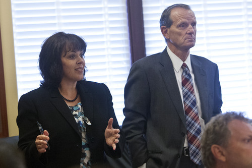 Chris Detrick  |  The Salt Lake Tribune
House Speaker Becky Lockhart, R-Provo, talks as House Majority Leader Brad Dee, R-Ogden, listens about the possibility of impeaching Attorney General John Swallow in the Utah House Republican caucus room Wednesday June 19, 2013.