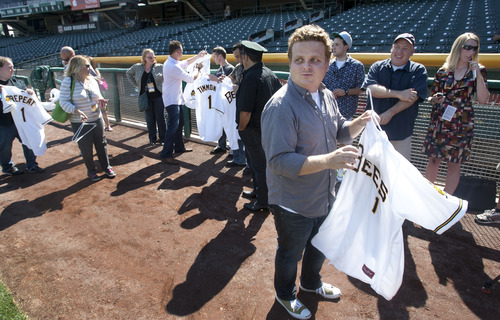 Steve Griffin | The Salt Lake Tribune


Patrick Renna, who played Ham Porter in the movie "Sandlot," puts on a Bees jersey with his name on it as the meet current Bees players following batting practice at SpringMobile Ballpark in Salt Lake City, Utah Friday July 19, 2013. Cast members from the movie were at the ball park celebrating the anniversary of the classic baseball film.