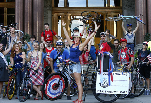 Scott Sommerdorf   |  The Salt Lake Tribune
The Bicycle Ambassadors - a group of experienced bikers working to teach new bikers the rules of the road - pose for a group photo at the City and County Building, prior to taking their monthly "Bike Party". This is their July ride with the theme "MERICA" in Salt Lake City, Saturday, July 13, 2013.