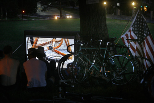 Scott Sommerdorf   |  The Salt Lake Tribune
The Bicycle Ambassadors watch a movie "With My Own Two Wheels" at the end of their monthly "Bike Party" for anyone who wants to join them. This is their July ride with the theme "MERICA" in Salt Lake City, Saturday, July 13, 2013.