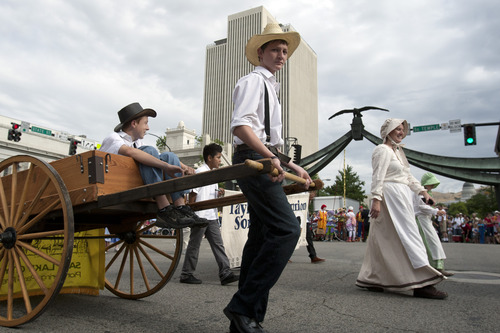Chris Detrick  |  The Salt Lake Tribune
Members of theTaylorsville Bennion Sons of Utah Pioneers participate in the 163rd annual Days of '47 KSL 5 Parade Tuesday July 24, 2012.