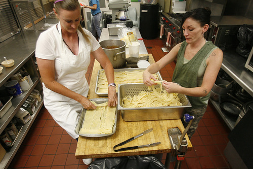 Scott Sommerdorf   |  The Salt Lake Tribune
Bonnie Leavitt, left, and Tasha Vincent make lasagna in the kitchen at the Orange Street Community Correctional Center in Salt Lake City, Thursday, July 18, 2013. Both women said the center has been a "blessing" in allowing them to transition back to society after time in prison.