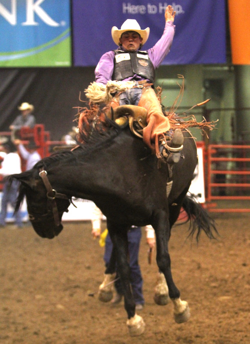 Rick Egan  | The Salt Lake Tribune 

Cole Elshere, Faith, SD, competes in the Saddle Bronc Riding competition, in the Days of '47 Rodeo, at EnergySolutions Arena, Monday, July 22, 2013.