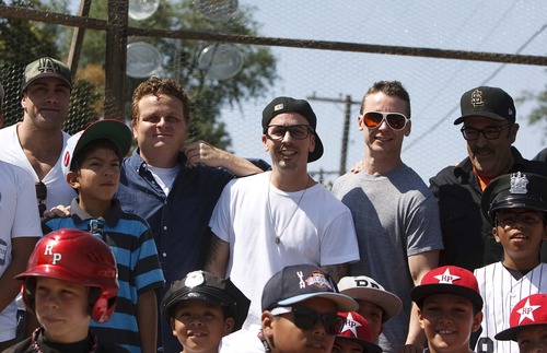 Leah Hogsten  |  The Salt Lake Tribune
l-r "The Sandlot" actors Marty York (Yeah-Yeah), Patrick Renna, (Hamilton "Ham" Porter), Chauncey Leopardi (Squints),  Victor DiMattia (Timmy Timmons) and Daniel Zacapa (Police Chief) pose for pictures. The Salt Lake Bees baseball players conducted a morning clinic with Glendale and Rose Park area kids on original sandlot field, Saturday, July 20, 2013 for the 20th anniversary of "The Sandlot," the classic baseball movie filmed primarily in Utah.