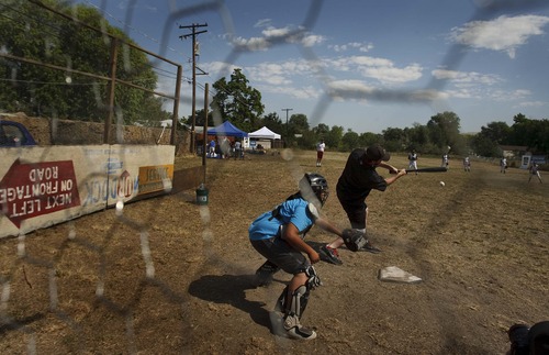 Leah Hogsten  |  The Salt Lake Tribune
The Salt Lake Bees baseball players conducted a morning clinic with Glendale and Rose Park area kids on original sandlot field on Saturday for the 20th anniversary of "The Sandlot," the classic baseball movie filmed primarily in Utah.