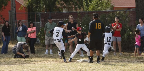 Leah Hogsten  |  The Salt Lake Tribune
The Salt Lake Bees baseball players conducted a morning clinic with Glendale and Rose Park area kids on original sandlot field, Saturday, July 20, 2013 for the 20th anniversary of "The Sandlot," the classic baseball movie filmed primarily in Utah.