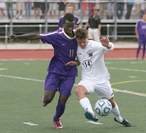Paul Fraughton  |   Salt Lake Tribune
  Lehi's Bosco Muhire and Brighton's Seth Frankhauser battle for the ball in their semifinal soccer match played at Woods Cross High. Lehi won the game in an overtime shootout.                          
 Tuesday, May 21, 2013