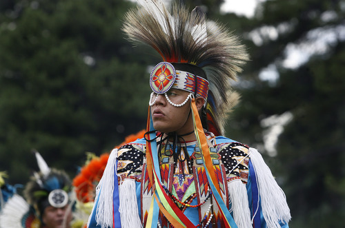 Scott Sommerdorf   |  The Salt Lake Tribune
The opening procession and grand entry of dancers into the ring at the Native American celebration in the Park - the annual Pioneer Day event celebrating American Indian culture, Wednesday, July 24, 2013.