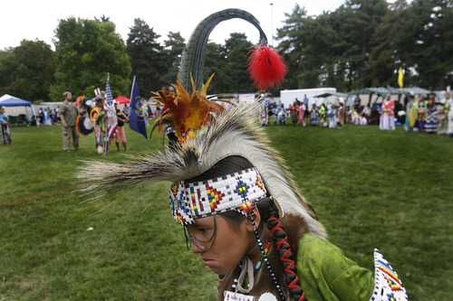 Scott Sommerdorf   |  The Salt Lake Tribune
Navajo dancer Jon Moreno, 10, after the opening procession and grand entry of dancers into the ring at the Native American celebration in the Park - the annual Pioneer Day event celebrating American Indian culture, Wednesday, July 24, 2013.