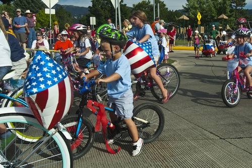 Chris Detrick  |  The Salt Lake Tribune
Children from St. Olaf Catholic School ride bikes during the 62nd annual Bountiful Handcart Days Grand Parade Tuesday July 23, 2013.