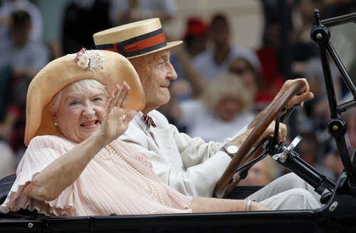 Al Hartmann  |  The Salt Lake Tribune
Sarah and Ed Allen ride in their 1924 Dodge Touring car in period costume at Days of '47 Parade in downtown Salt Lake City Wednesday July 24.