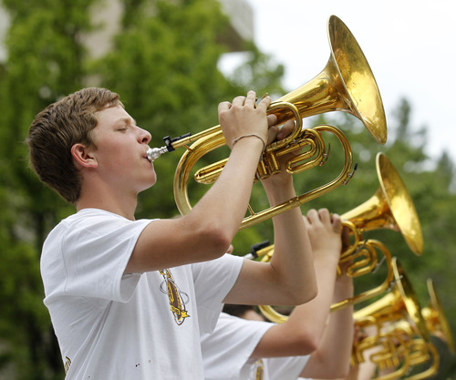 Al Hartmann  |  The Salt Lake Tribune
Horn section members of the Davis High School band play in the Days of '47 Parade in downtown Salt Lake City Wednesday July 24.