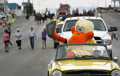 Scott Sommerdorf  |  The Salt Lake Tribune
Kiwanis Club bird waves to the crowd at the International Days Parade in Price, Saturday, July 27, 2013.