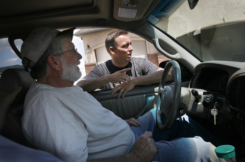 Scott Sommerdorf   |  The Salt Lake Tribune
Tyler Albrecht, bishop of the Cedar City 11th Ward talks with Ken Price, who was driving a truck loaded with sandbags to help out with the cleanup in the Equestrian Pointe neighborhood of west Cedar City, Sunday, July 28, 2013.