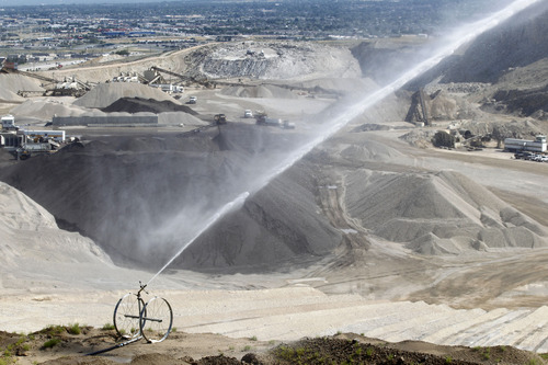 Al Hartmann  |  The Salt Lake Tribune
One of several moveable sprinklers wets down an area at Geneva Rock near Point of the Mountain. Geneva Rock has updated its equipment to address complaints about dust. But neighbors are up in arms over the dust and its potential health impacts.