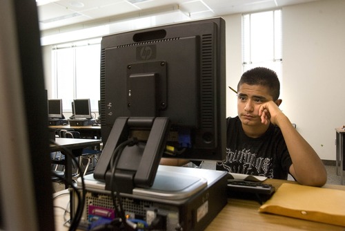 Paul Fraughton  |   Salt Lake Tribune
Alex Trujillo works on a computer in a  summer school class at the new Granger High School in West Valley City. Granger will be the first Utah high school to be designated a Title I school.                           
 Monday, July 15, 2013