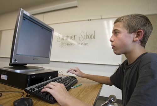 Paul Fraughton  |   Salt Lake Tribune
Dominique Blatnick studies in a summer school class at the new Granger High School in West Valley City. Granger will be the first Utah high school to be designated a Title I school.                           
 Monday, July 15, 2013